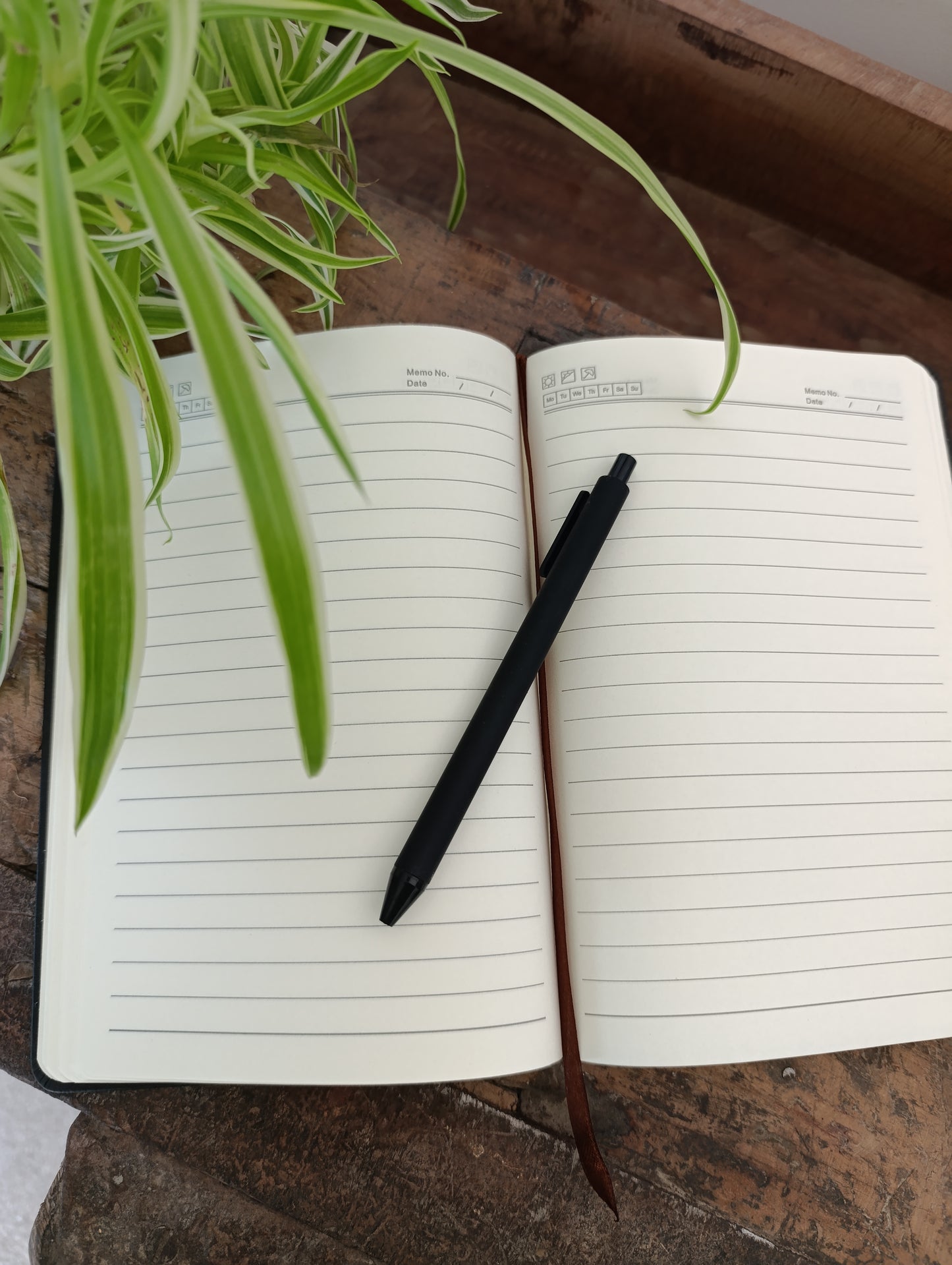 Gepersona- liseerd notitieboekje met pen